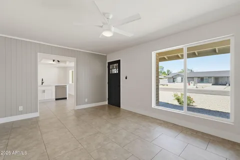 a view of an empty room with a window