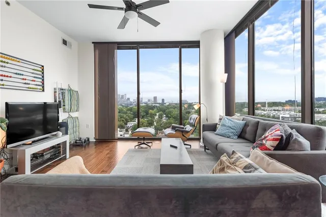 a living room with furniture and a flat screen tv