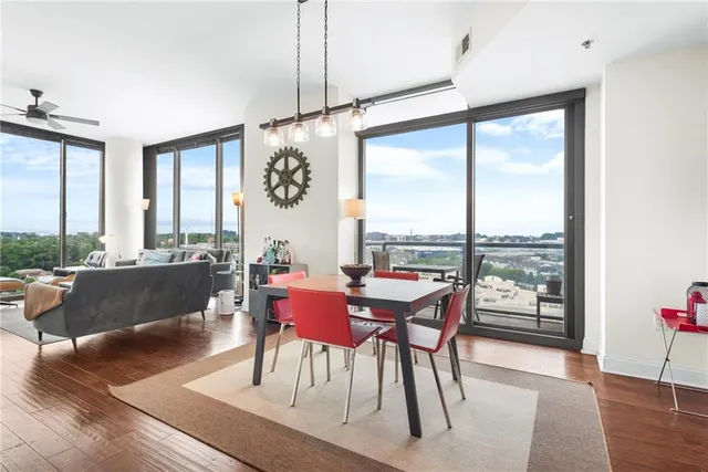 a view of a dining room with furniture window and wooden floor