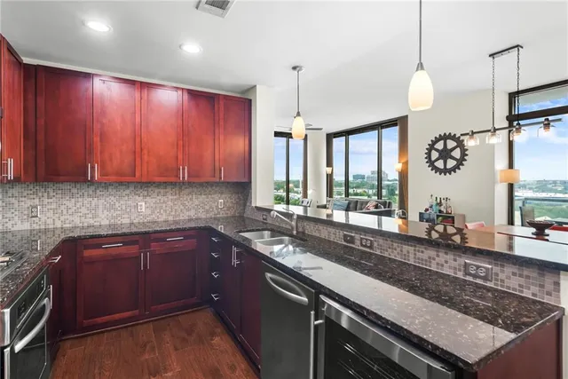 a kitchen with a sink and wooden cabinets