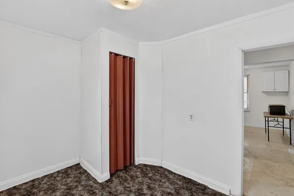 a living room with couch and a window