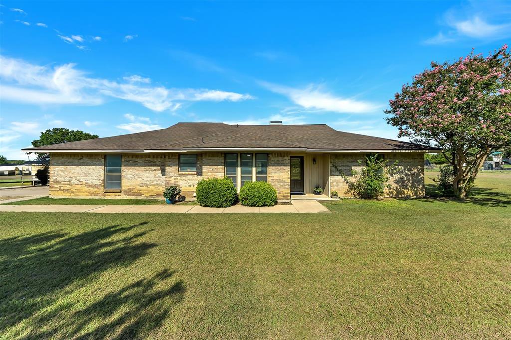 6731 Canyon Road Sanger, TX 76266 - Photo 1 of 1 a front view of a house with a garden