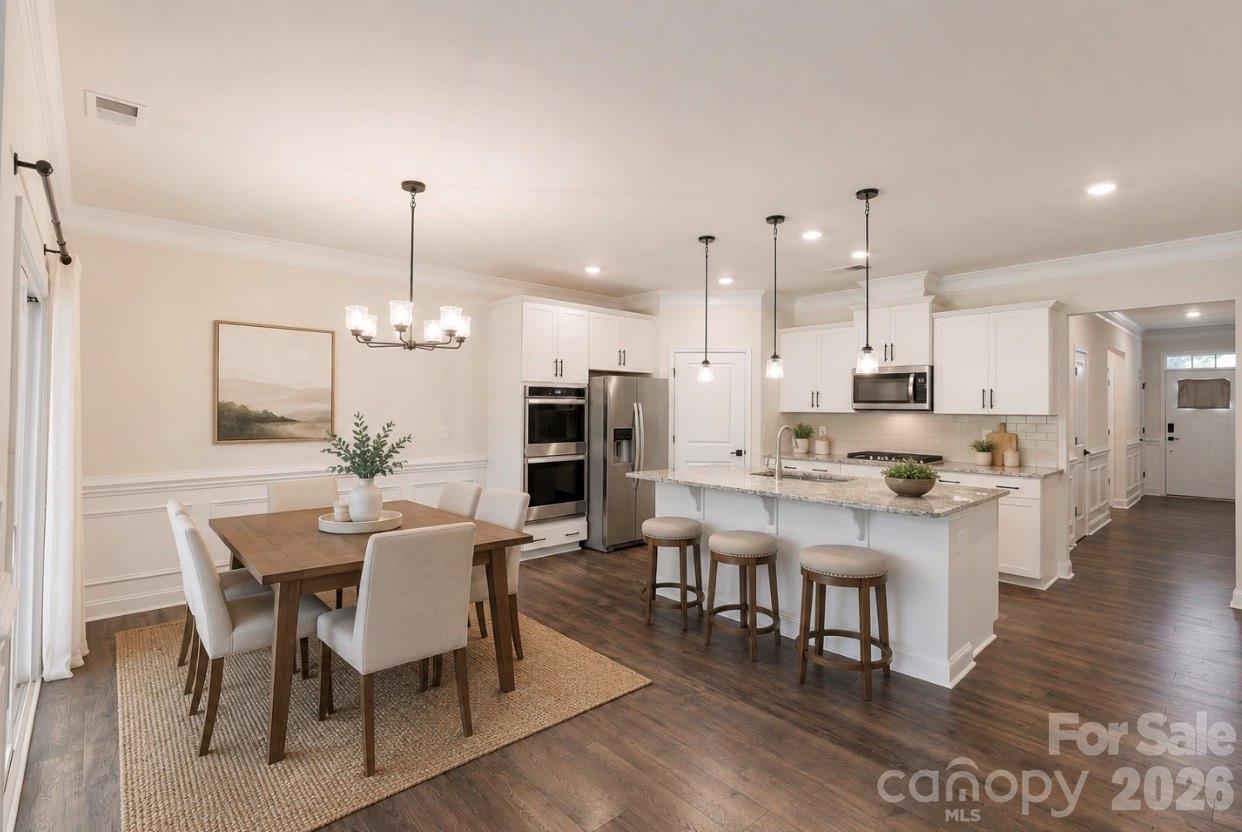 4229 Millstream Road Denver, NC 28037 - Photo 1 of 34 a large kitchen with a table and chairs