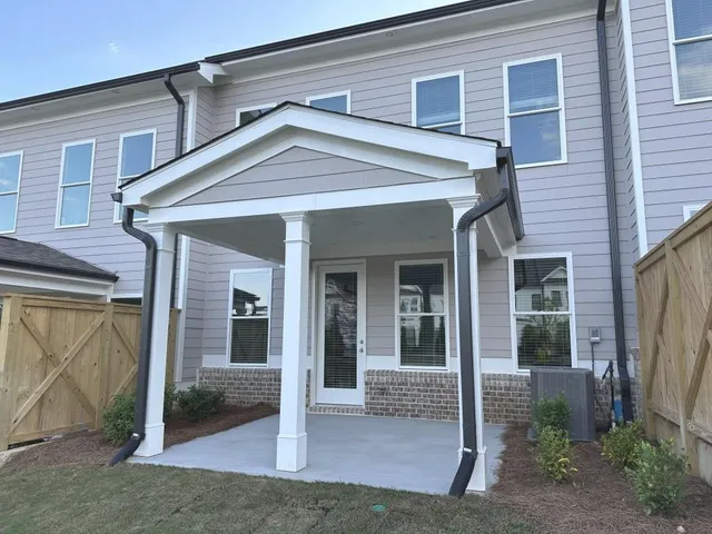 a front view of a house with a porch
