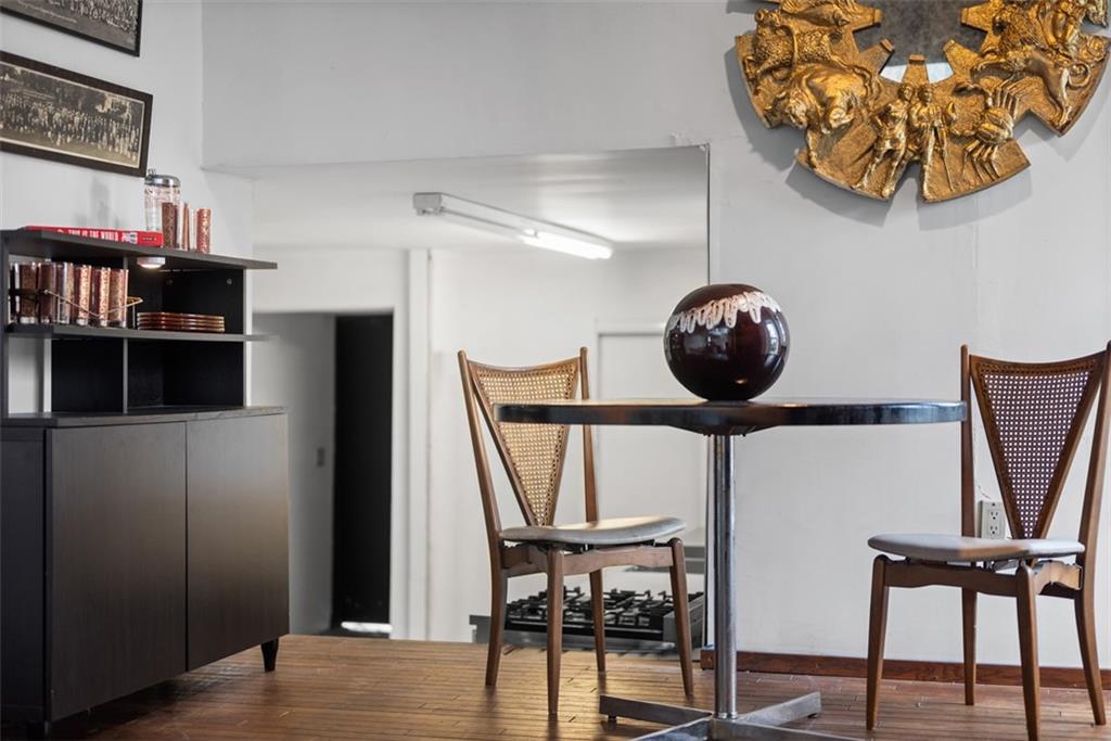 23 Seneca Street Pittsburgh, PA 15219 - Photo 11 of 38 a view of a hallway with seating area and workspace