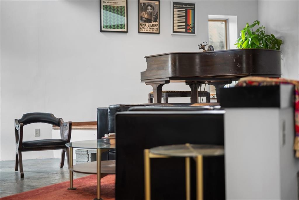 23 Seneca Street Pittsburgh, PA 15219 - Photo 12 of 38 a living room with furniture and potted plants
