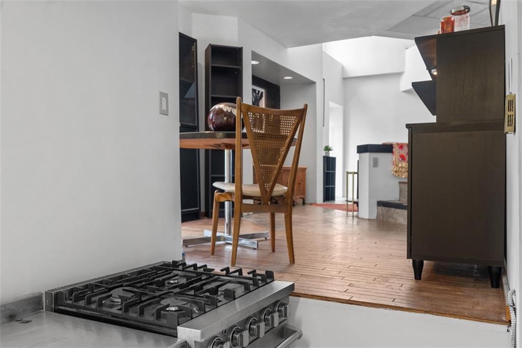 23 Seneca Street Pittsburgh, PA 15219 - Photo 15 of 38 a living room with furniture and a table
