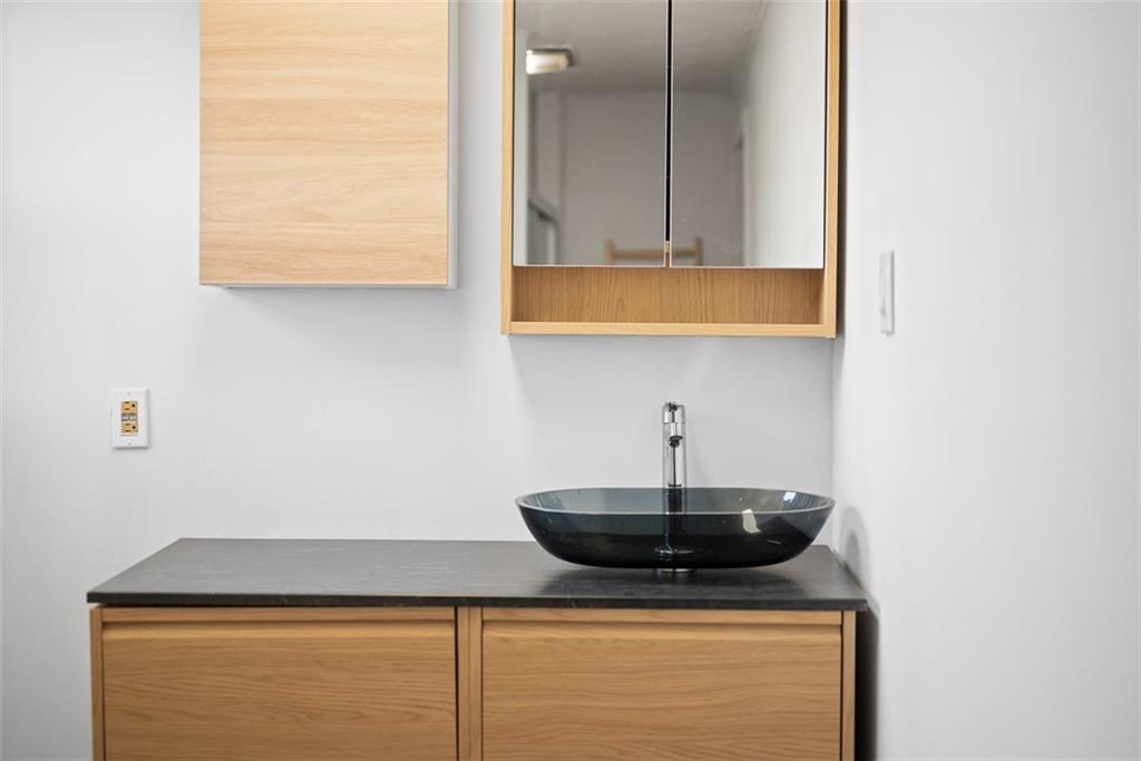 23 Seneca Street Pittsburgh, PA 15219 - Photo 22 of 38 a kitchen with a sink and cabinets