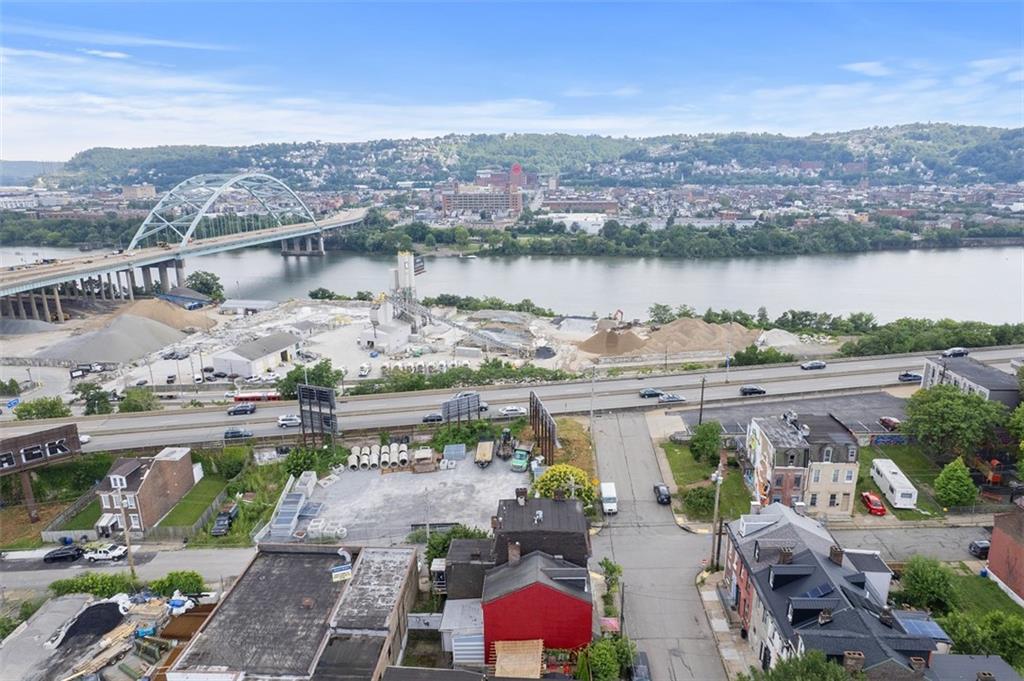 23 Seneca Street Pittsburgh, PA 15219 - Photo 35 of 38 an aerial view of a house with a lake view