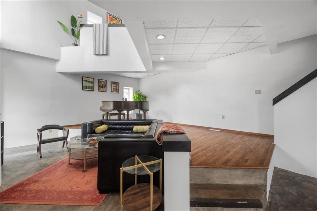 23 Seneca Street Pittsburgh, PA 15219 - Photo 8 of 38 a room with furniture and a table