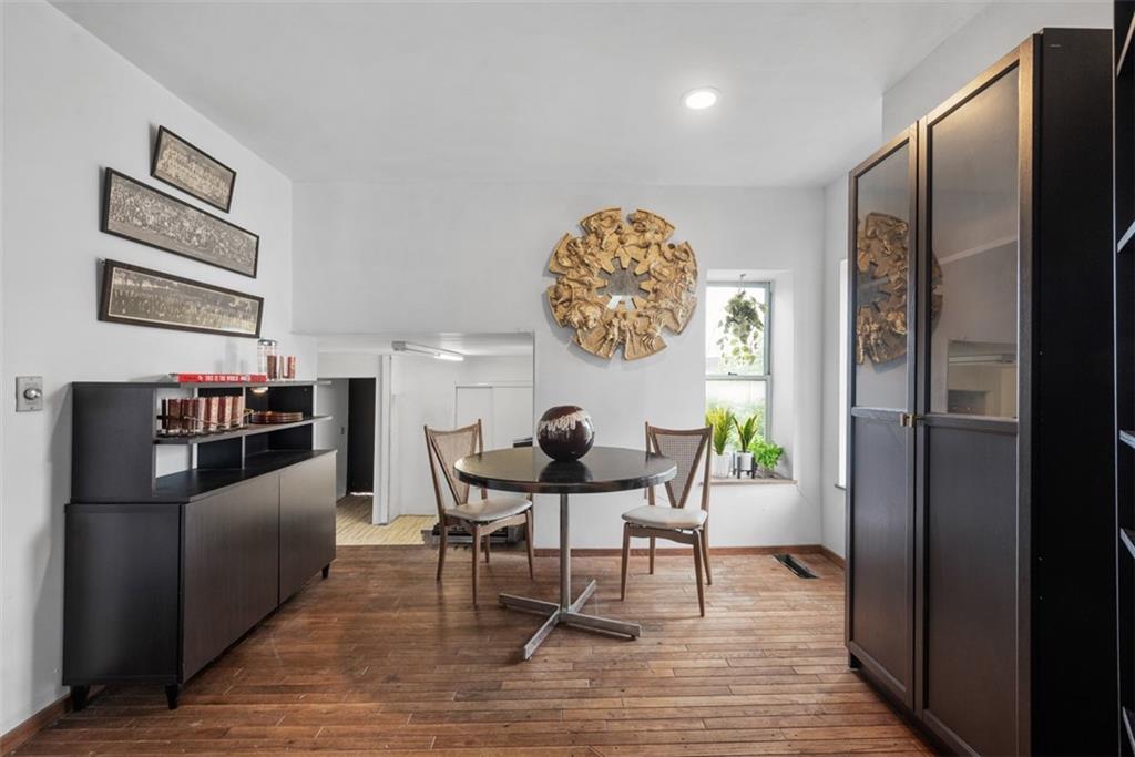 23 Seneca Street Pittsburgh, PA 15219 - Photo 10 of 38 a view of a dining room with furniture and wooden floor