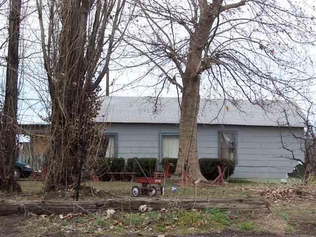 1080 Hickory Road Grandview, WA 98930 - Photo 1 of 1 a backyard of a house with table and chairs