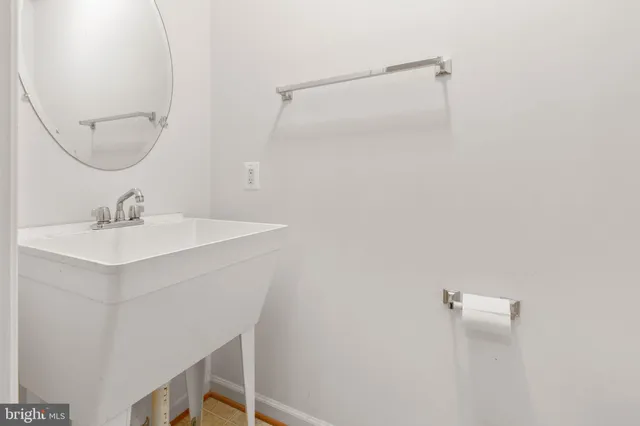 a bathroom with a sink a vanity and a mirror