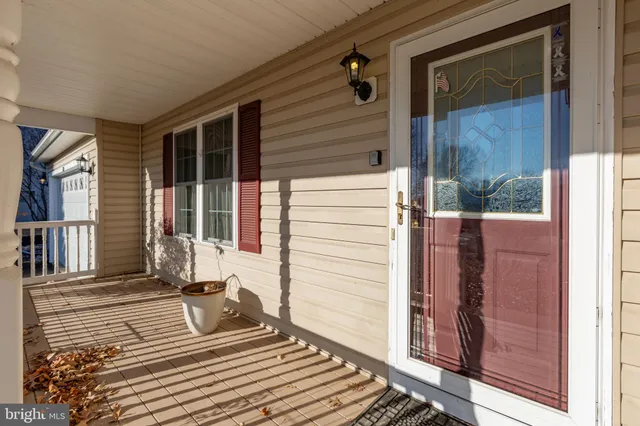 a view of a house with a door and wooden floor