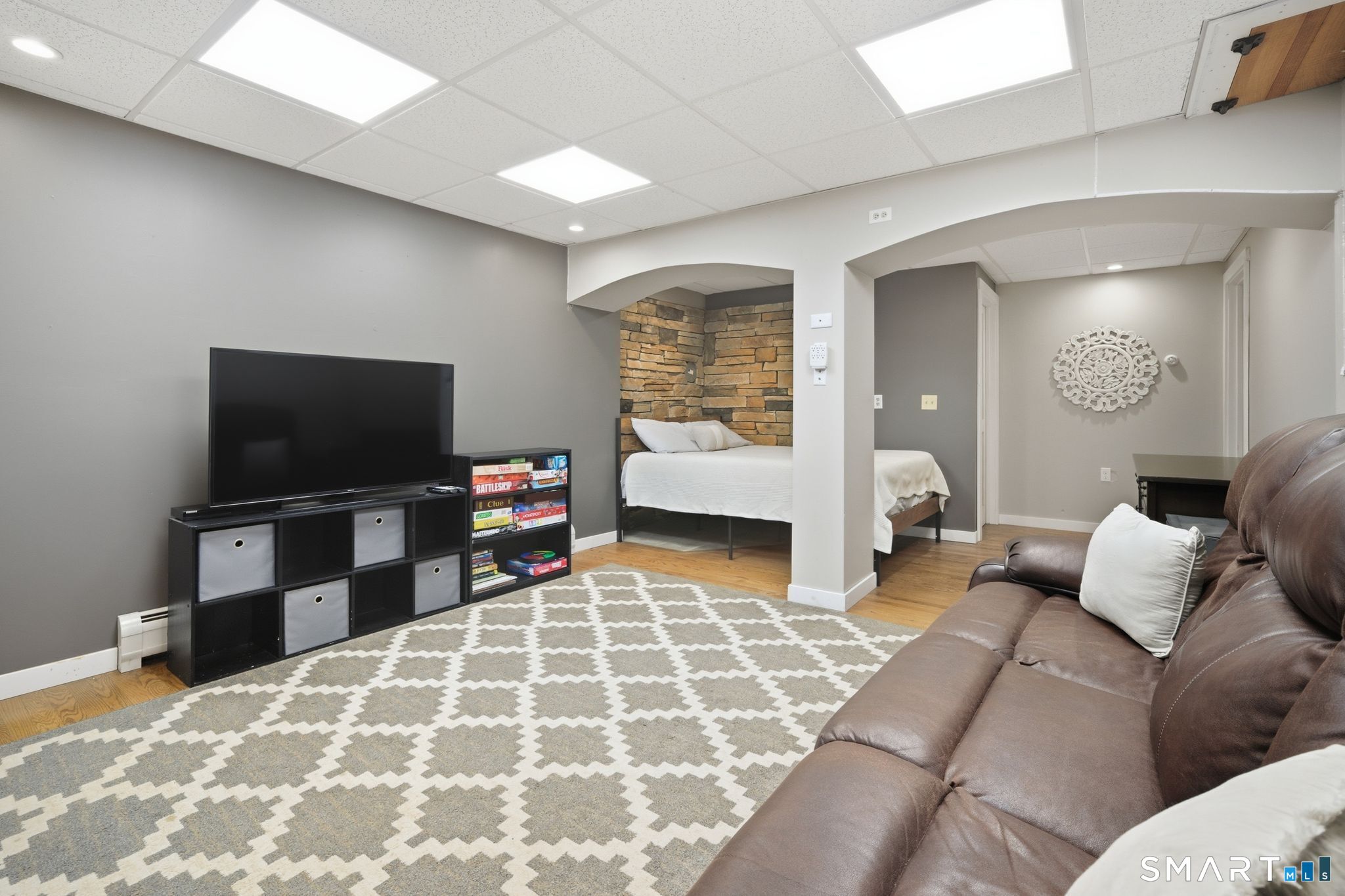 174 Walnut Hill Road Hartland, CT 06027 - Photo 29 of 36 a living room with furniture and a flat screen tv