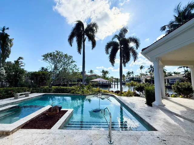 a view of a room with furniture and chandelier