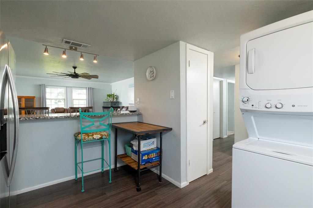 108 Harbor Drive, Unit 204 Runaway Bay, TX 76426 - Photo 12 of 22 a kitchen with a table and chairs in it