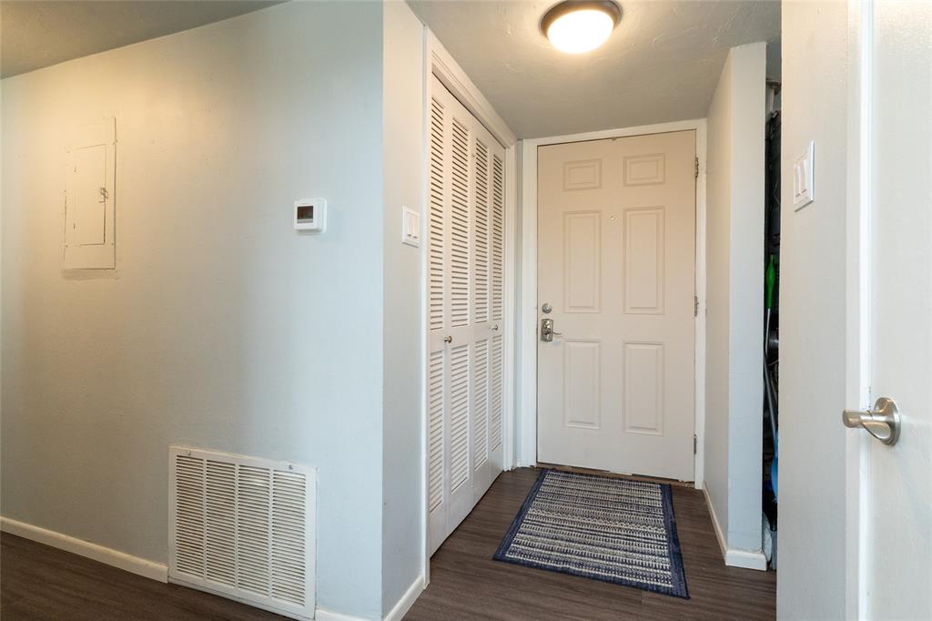 108 Harbor Drive, Unit 204 Runaway Bay, TX 76426 - Photo 4 of 22 a view of a room with wooden floor and windows
