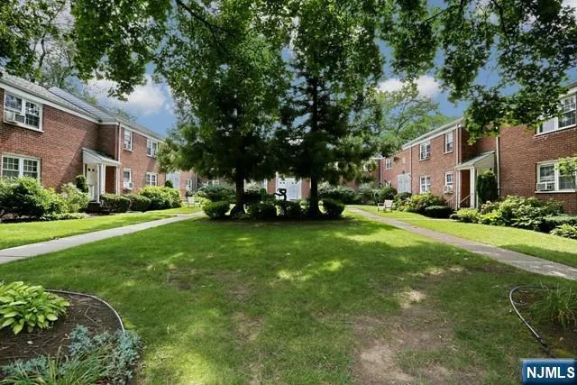 a view of a house with backyard