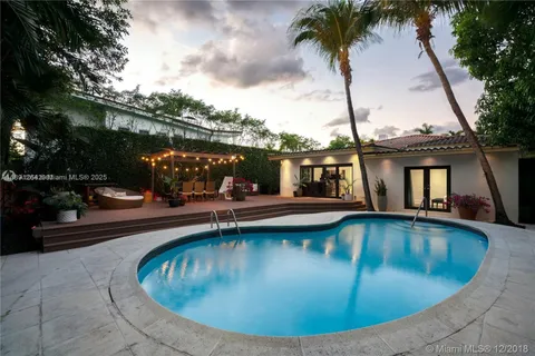 a view of a swimming pool with a lounge chairs
