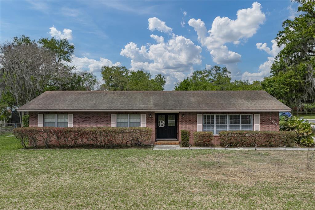 609 West Pipkin Road Lakeland, FL 33813 - Photo 64 of 72 a front view of a house with a garden