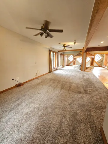 a kitchen with a sink and large window