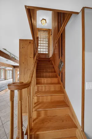 a view of an entryway with wooden floor