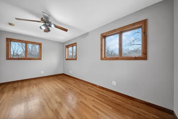 a view of a room with wooden floor and stairs