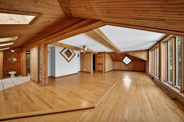 an aerial view of a house with a yard