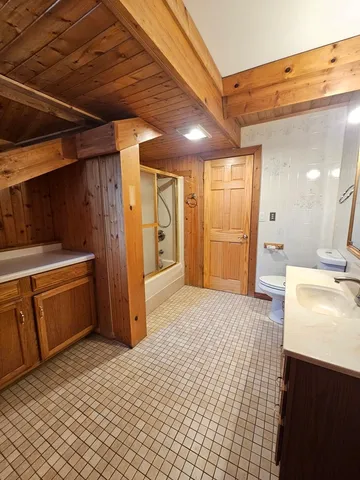 a kitchen with a refrigerator and a sink