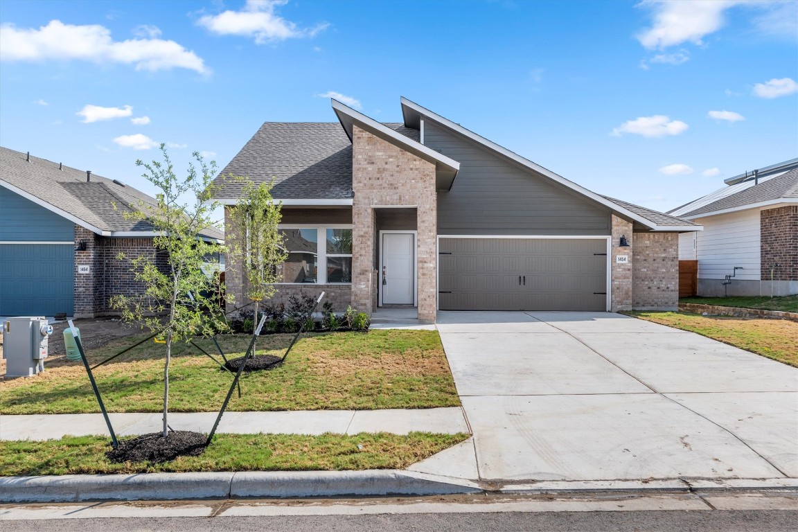 1454 Marley Kyle, TX 78640 - Photo 1 of 1 a front view of a house with garden