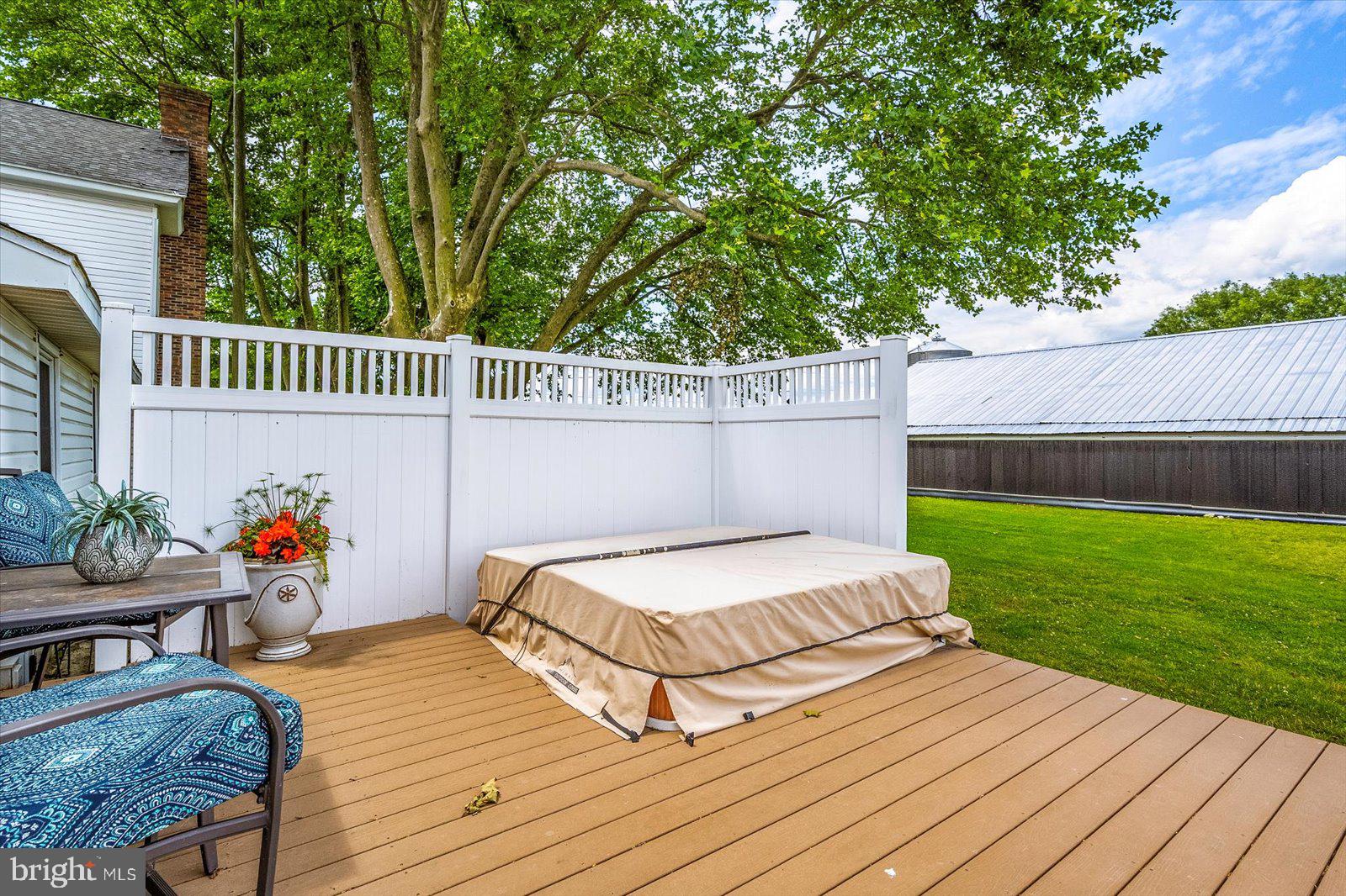 8807 Woodland Ferry Road Laurel, DE 19956 - Photo 63 of 90 Composite decking with hot tub and privacy fence