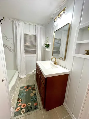a bathroom with sink and mirror