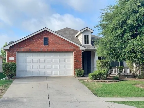 a front view of a house with a garage