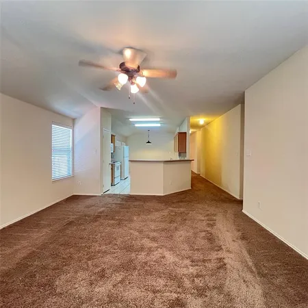 a view of a kitchen with a sink and a window