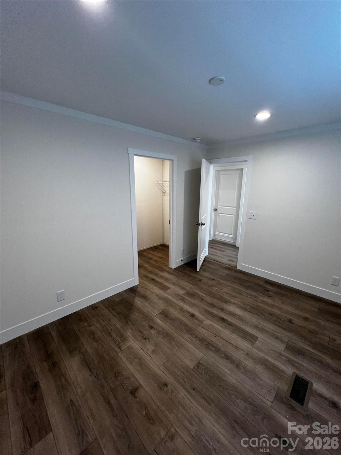 111 Overcash Road Troutman, NC 28166 - Photo 15 of 19 a view of an empty room with wooden floor and closet