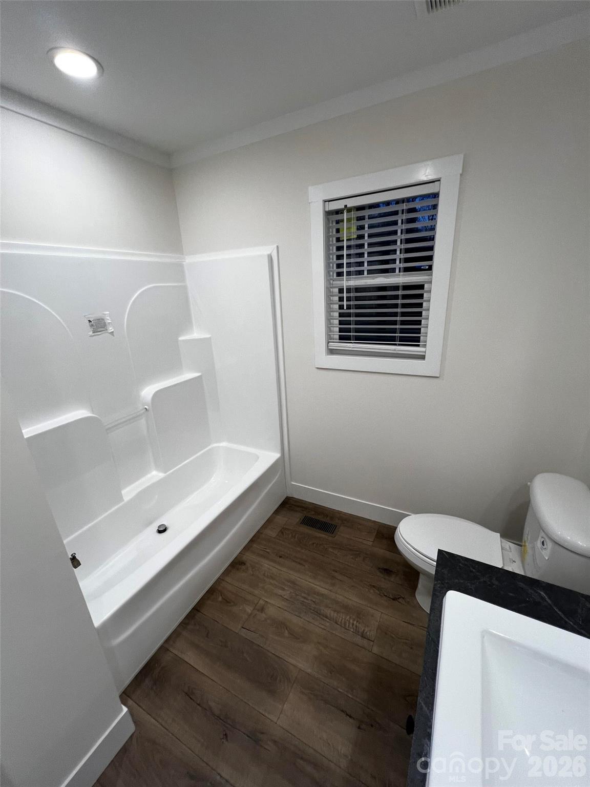 111 Overcash Road Troutman, NC 28166 - Photo 17 of 19 a bathroom with a bathtub and a shower