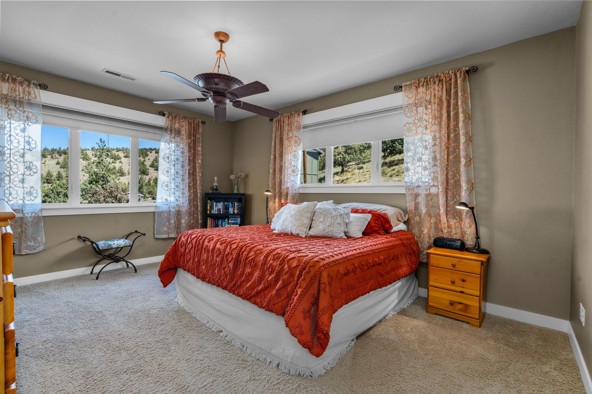 10875 Southwest Mintken Lane Culver, OR 97734 - Photo 11 of 43 a bedroom with a bed and a chandelier