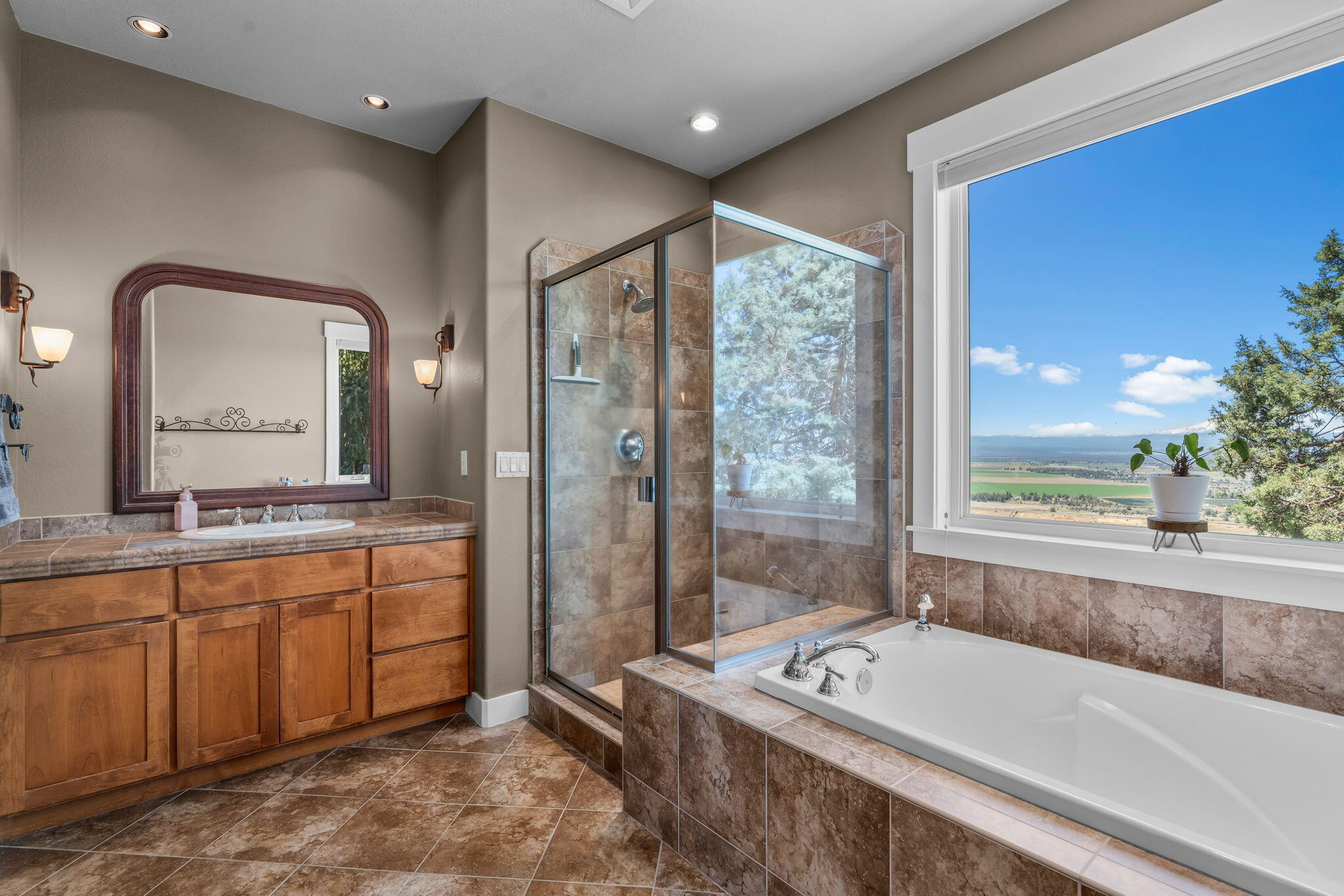 10875 Southwest Mintken Lane Culver, OR 97734 - Photo 13 of 43 a bathroom with a tub sink and mirror