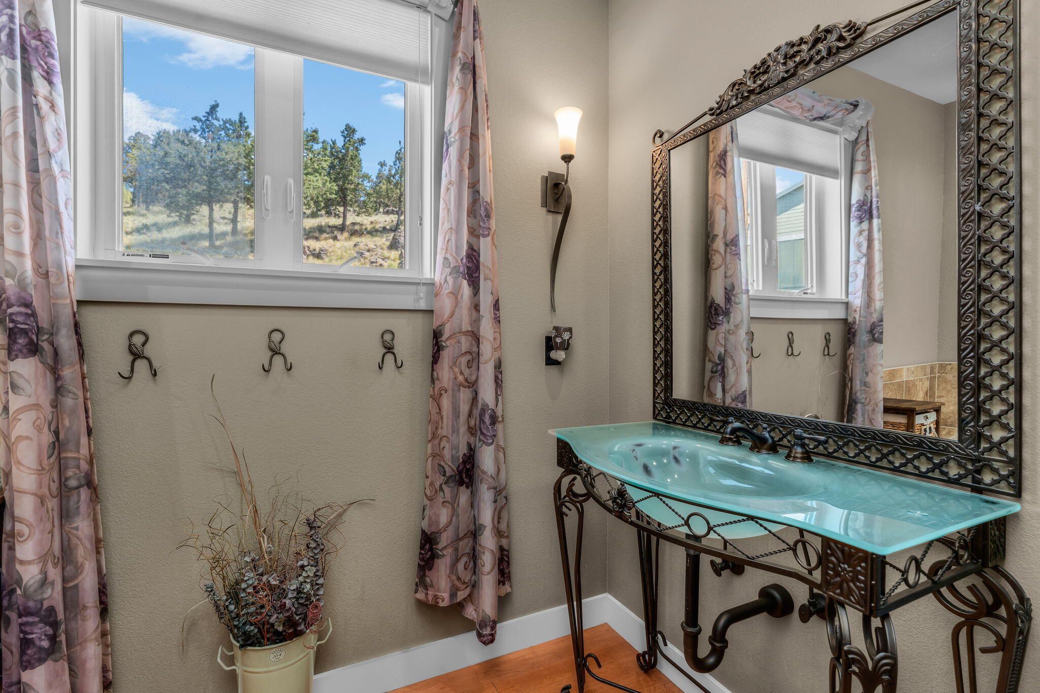 10875 Southwest Mintken Lane Culver, OR 97734 - Photo 17 of 43 a bathroom with a granite countertop sink a mirror and a shower
