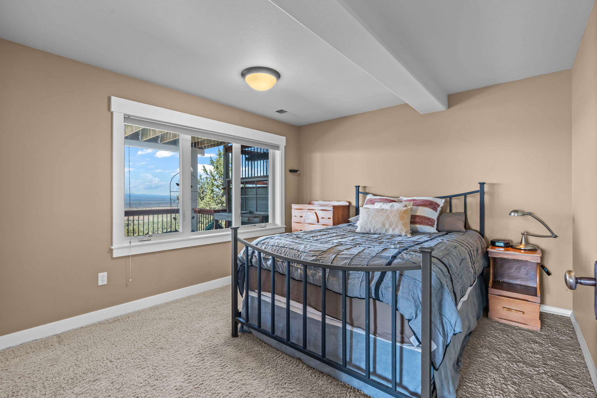 10875 Southwest Mintken Lane Culver, OR 97734 - Photo 22 of 43 a bedroom with a bed a window and walk in closet