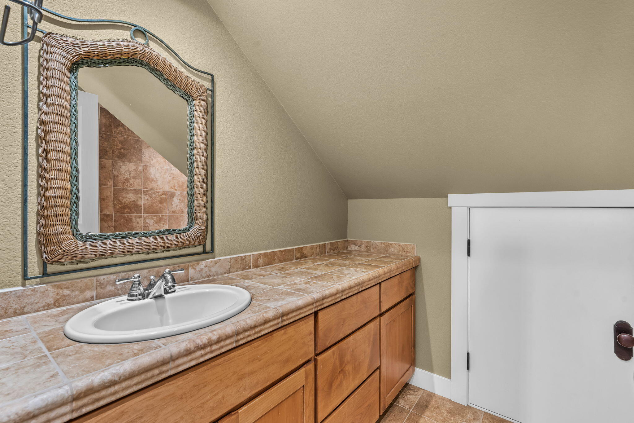 10875 Southwest Mintken Lane Culver, OR 97734 - Photo 24 of 43 a bathroom with a granite countertop sink and a mirror