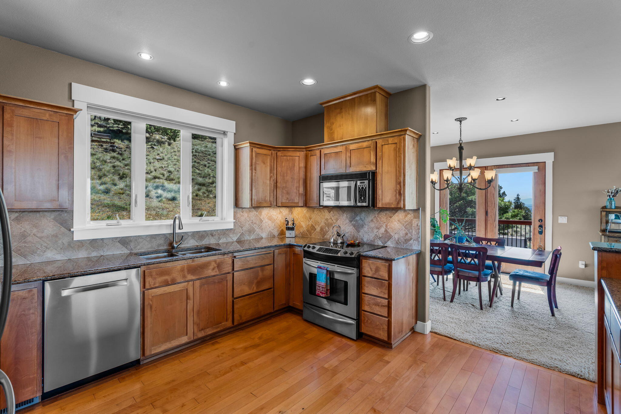 10875 Southwest Mintken Lane Culver, OR 97734 - Photo 4 of 43 a kitchen with lots of counter top space and dining table