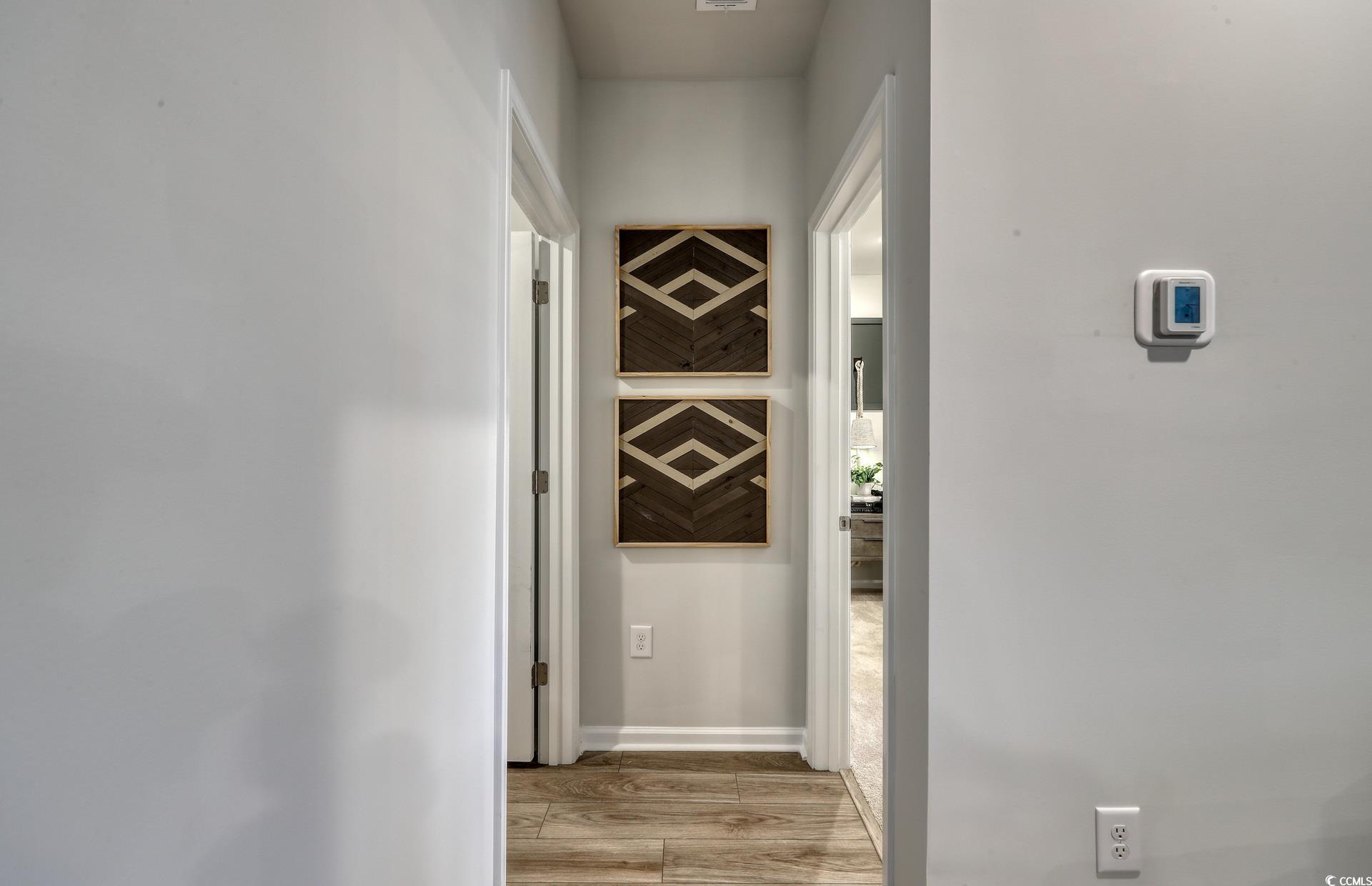 3090 Visionary Drive Myrtle Beach, SC 29588 - Photo 12 of 28 Corridor with light wood finished floors and baseboards