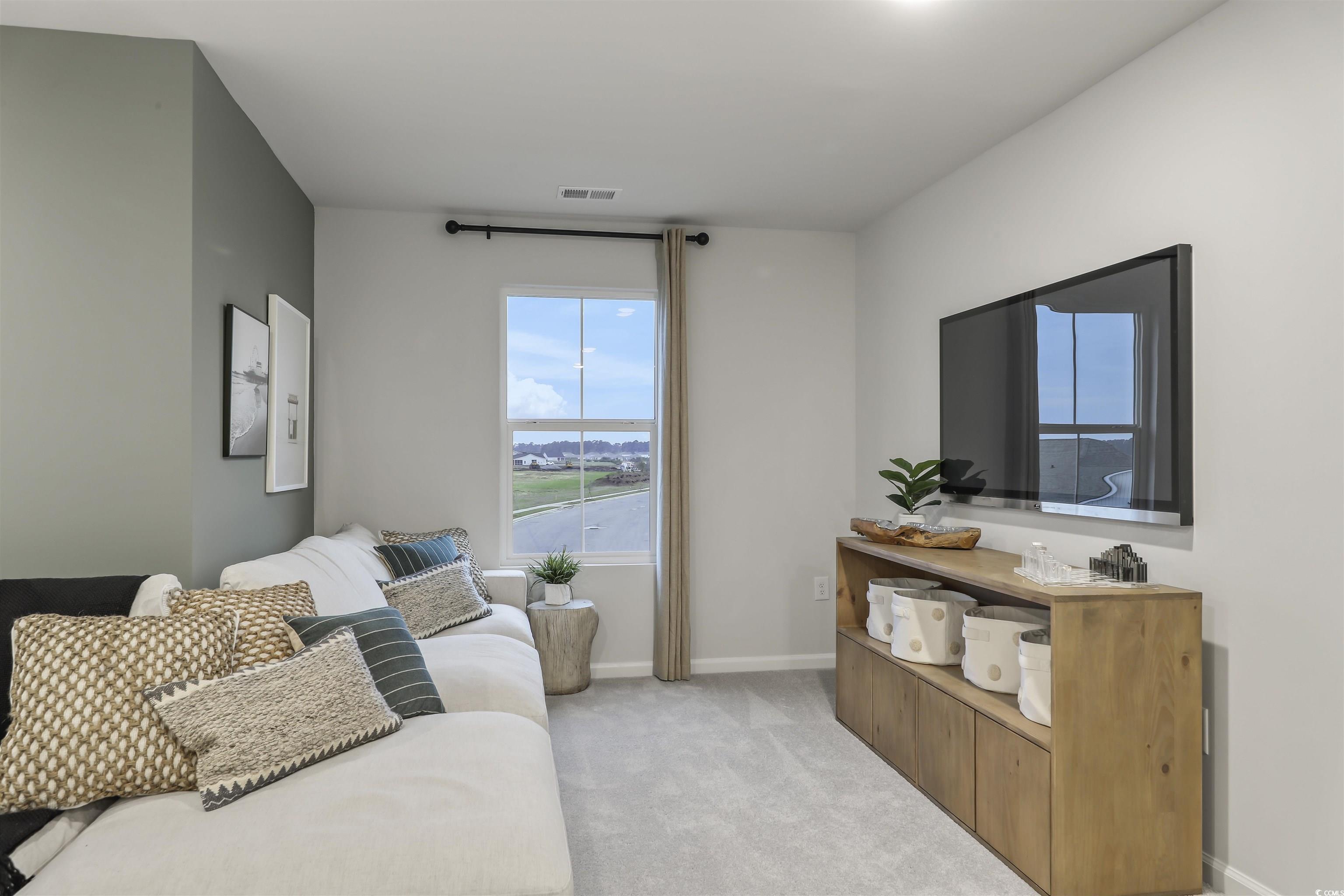 3090 Visionary Drive Myrtle Beach, SC 29588 - Photo 20 of 28 Bedroom with light colored carpet and baseboards