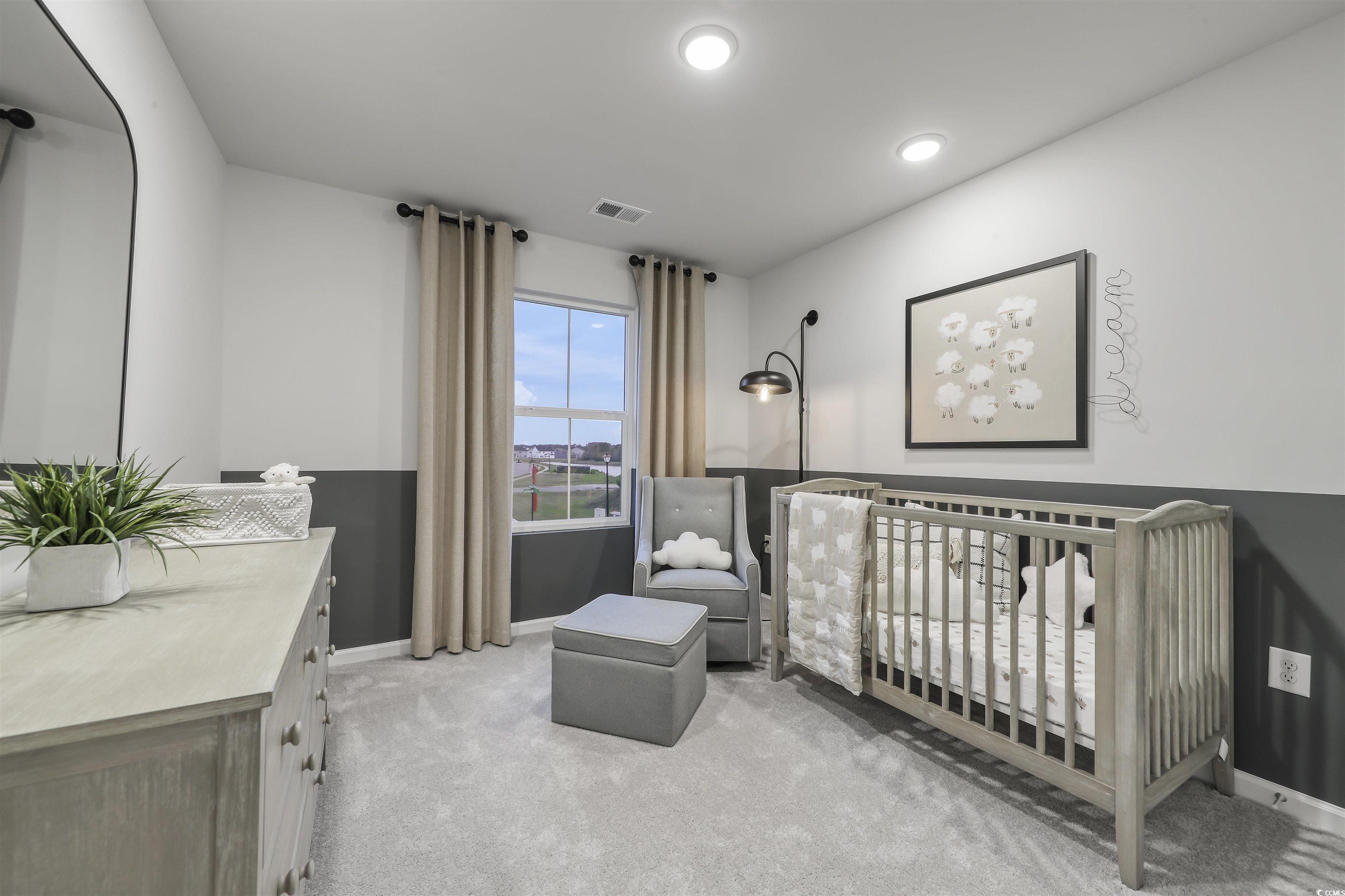 3090 Visionary Drive Myrtle Beach, SC 29588 - Photo 24 of 28 Bedroom featuring light colored carpet and a nursery area