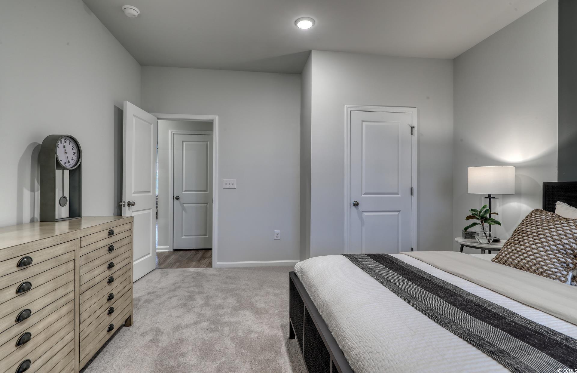 3090 Visionary Drive Myrtle Beach, SC 29588 - Photo 4 of 28 Bedroom featuring light colored carpet and baseboards