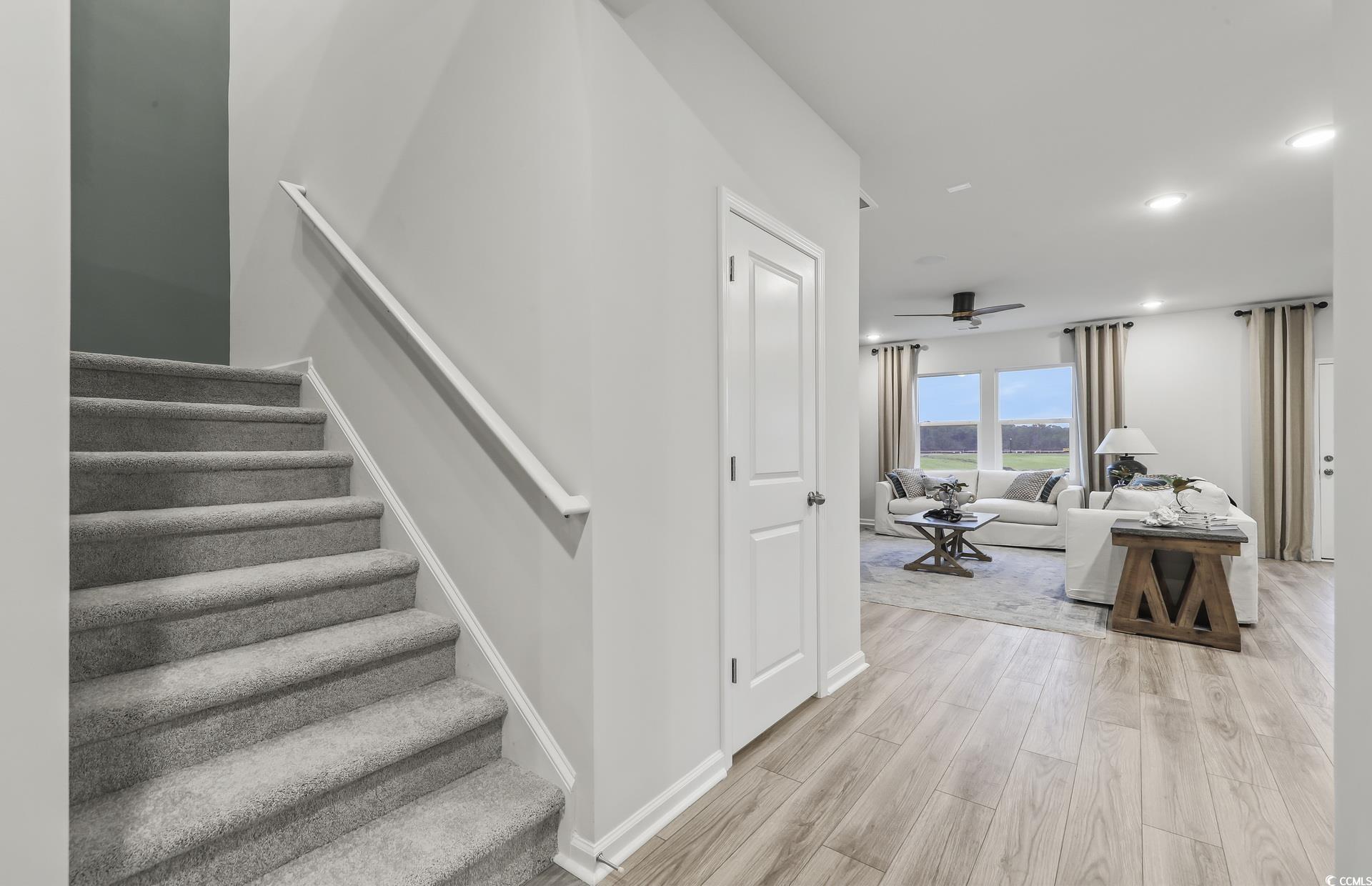 3090 Visionary Drive Myrtle Beach, SC 29588 - Photo 6 of 28 Stairway featuring wood finished floors, recessed lighting, and ceiling fan