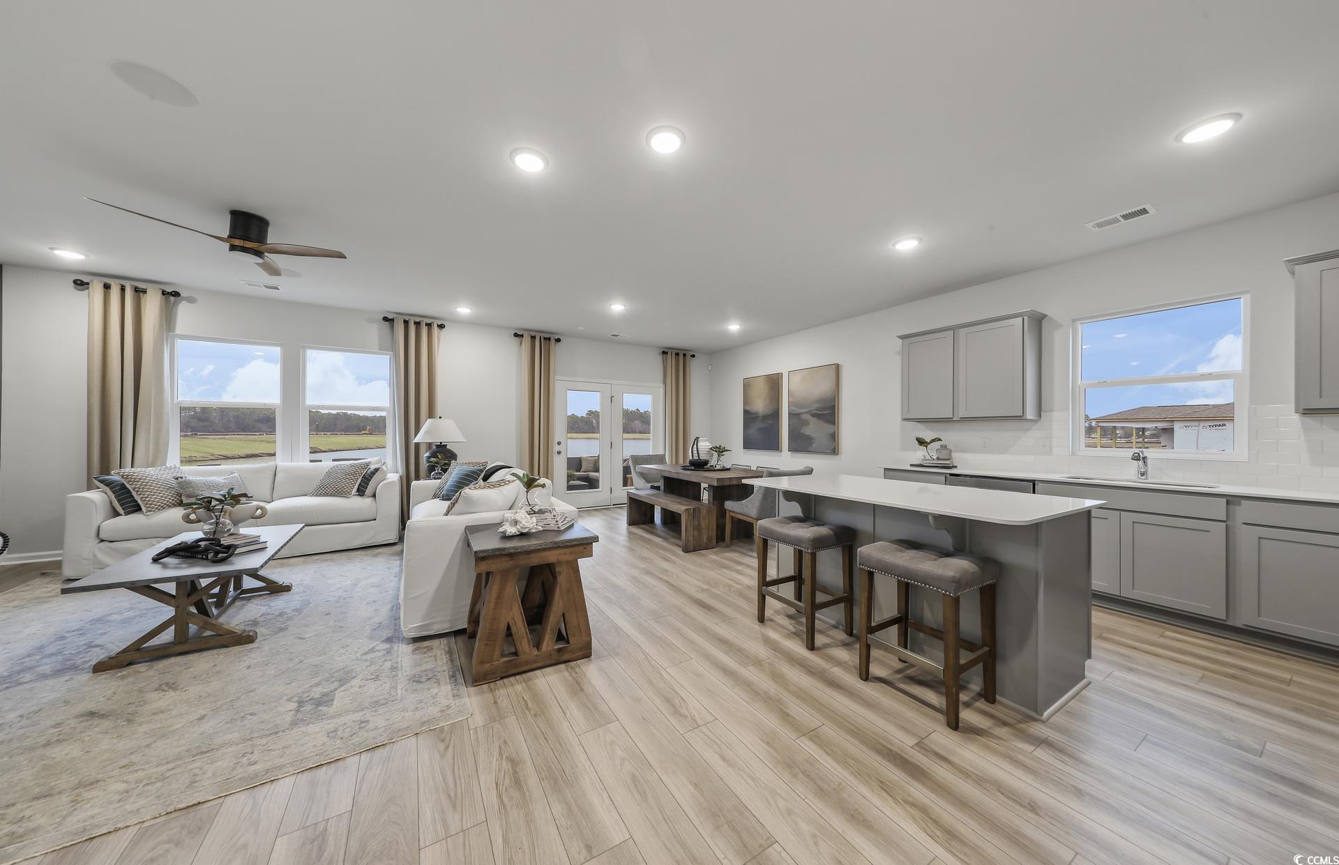 3090 Visionary Drive Myrtle Beach, SC 29588 - Photo 8 of 28 Living area featuring plenty of natural light, light wood-type flooring, recessed lighting, and a ceiling fan