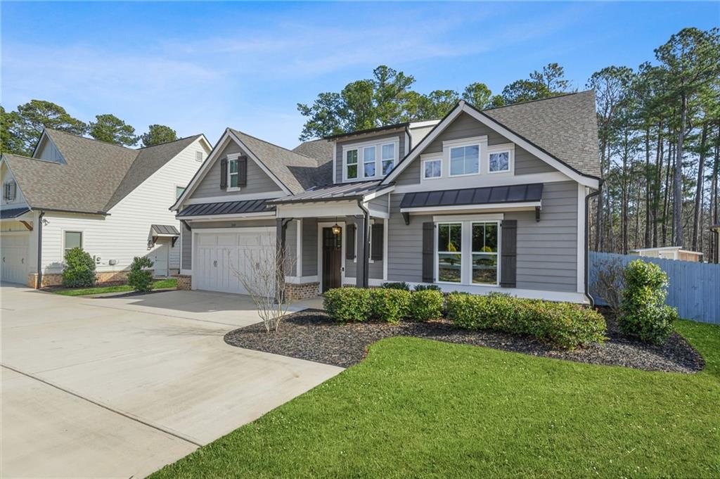 265 Holland Road Powder Springs, GA 30127 - Photo 1 of 27 a front view of a house with garden